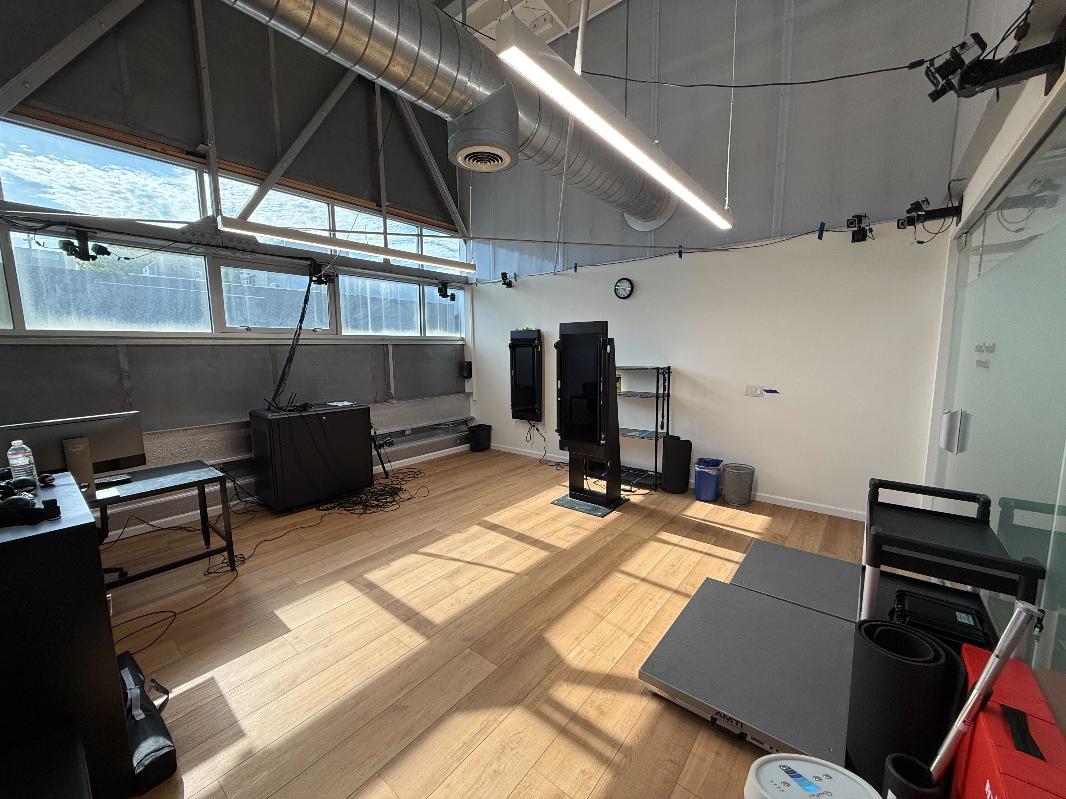 Motion capture laboratory with a Tonal trainer at the center of a Vicon camera rig